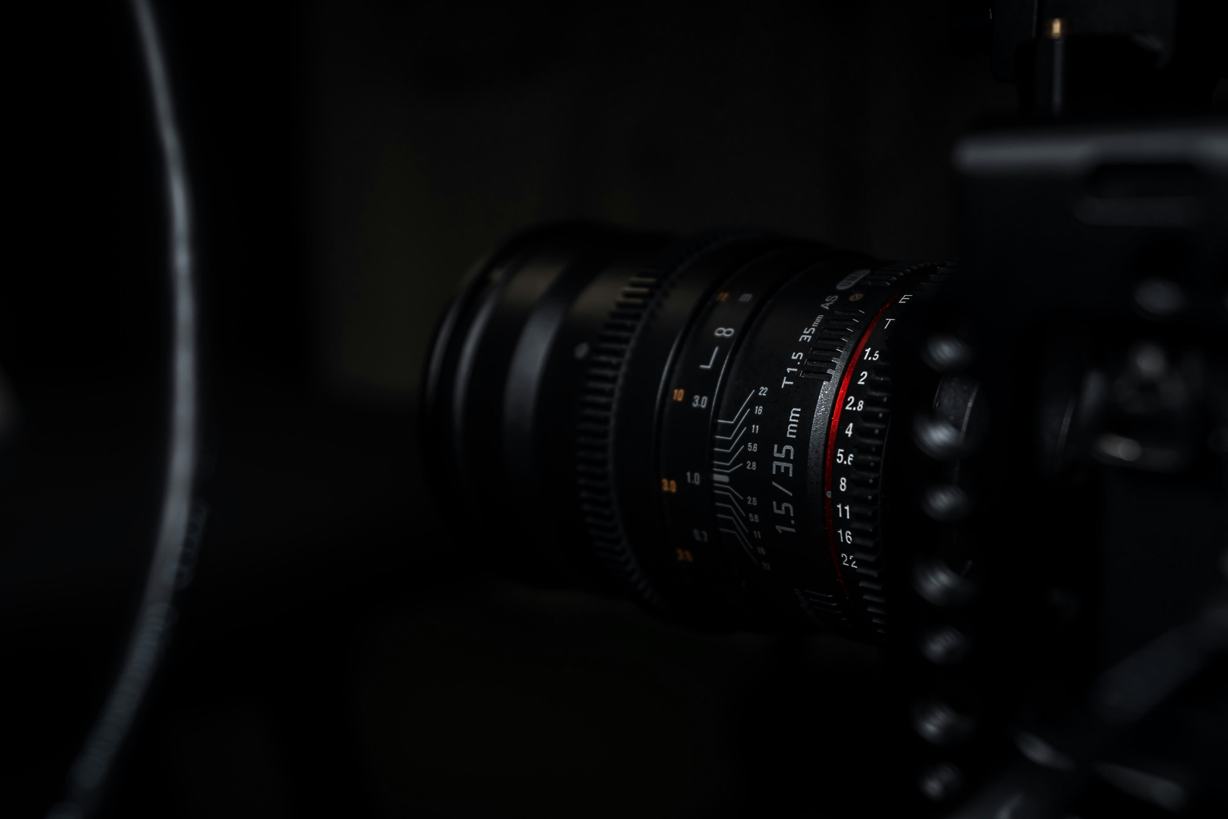 black camera lens on black surface